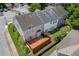 Aerial view of townhome featuring a wood deck and small fenced yard and proximity to neighborhood street at 2421 Elkhorn Ter, Duluth, GA 30096