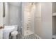 This bathroom features a pedestal sink and shower at 3530 E Ponce De Leon Ave, Scottdale, GA 30079