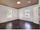 Bright bedroom features hardwood floors, fresh paint, and windows providing natural light at 3530 E Ponce De Leon Ave, Scottdale, GA 30079