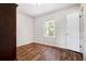 Bright bedroom with wood floors, window view and closet at 3530 E Ponce De Leon Ave, Scottdale, GA 30079