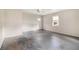Empty bedroom featuring ceiling fan and door leading to outside at 3530 E Ponce De Leon Ave, Scottdale, GA 30079