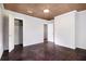Spacious bedroom features wood ceiling, large closet, and hardwood flooring at 3530 E Ponce De Leon Ave, Scottdale, GA 30079