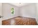 This cozy bedroom offers updated flooring and a sunlit window at 3530 E Ponce De Leon Ave, Scottdale, GA 30079