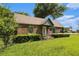 Charming brick home featuring a well-manicured lawn and mature trees at 3530 E Ponce De Leon Ave, Scottdale, GA 30079