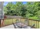 Backyard featuring a patio with a table and chairs, surrounded by lush greenery at 6738 Brookfield Way, Douglasville, GA 30134