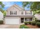 Charming two-story home featuring a well-maintained front yard and attached garage at 6738 Brookfield Way, Douglasville, GA 30134