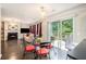 Open-concept living room with hardwood floors, fireplace, and sliding glass doors to the deck at 6738 Brookfield Way, Douglasville, GA 30134