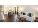 Bright living room and dining room featuring hardwood floors, sofa, and dining table at 6738 Brookfield Way, Douglasville, GA 30134