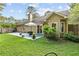 Spacious backyard featuring a well-maintained lawn, patio area, and privacy fencing at 117A Laguna Springs Dr, Woodstock, GA 30188