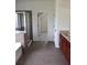 Bathroom with ceramic tile flooring and granite countertops at 1365 Slate Bend Dr, Dacula, GA 30019