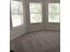 Neutral bedroom with plush carpet and bright sunny windows at 1365 Slate Bend Dr, Dacula, GA 30019