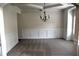 Dining room with carpet, neutral paint, white trim and a chandelier at 1365 Slate Bend Dr, Dacula, GA 30019