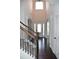 Front foyer with entry door, wooden staircase, and dark wooden floors at 1365 Slate Bend Dr, Dacula, GA 30019