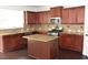 The kitchen features granite countertops, stainless steel appliances, and a center island at 1365 Slate Bend Dr, Dacula, GA 30019