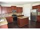Kitchen with stainless steel appliances, granite counters, tile backsplash, and center island at 1365 Slate Bend Dr, Dacula, GA 30019