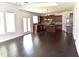 Open-concept living area with hardwood floors and a spacious kitchen at 1365 Slate Bend Dr, Dacula, GA 30019