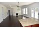 Spacious living area with hardwood floors, fireplace, and lots of natural light at 1365 Slate Bend Dr, Dacula, GA 30019