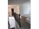 Stairwell with a dark metal railing at 1365 Slate Bend Dr, Dacula, GA 30019