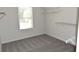 Walk-in closet with white metal shelves at 1365 Slate Bend Dr, Dacula, GA 30019