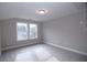 Comfortable bedroom with plush carpeting, neutral paint, and two windows providing plenty of natural light at 14 Berkten Ct, Hiram, GA 30141
