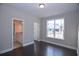Bedroom with bathroom access and natural light from a large window at 14 Berkten Ct, Hiram, GA 30141