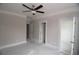 Neutral bedroom with ceiling fan, closet, and multiple access doors at 14 Berkten Ct, Hiram, GA 30141