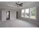 A bright bedroom with large windows, light walls, and an open doorway enhances the sense of space at 14 Berkten Ct, Hiram, GA 30141