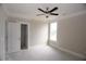 Bright bedroom with a ceiling fan, a window, and closet entrance at 14 Berkten Ct, Hiram, GA 30141