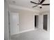 Large bedroom with ceiling fan, and multiple doorways leading to closet at 14 Berkten Ct, Hiram, GA 30141