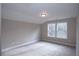 Bright and airy bedroom with plush carpeting, neutral paint, and ample natural light from two large windows at 14 Berkten Ct, Hiram, GA 30141
