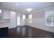 Dining room with hardwood floors, large windows and wainscoting at 14 Berkten Ct, Hiram, GA 30141