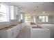 Bright, spacious kitchen featuring white cabinets and a center island at 14 Berkten Ct, Hiram, GA 30141