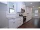 Kitchen featuring stainless steel appliances, white cabinetry, and subway tile backsplash at 14 Berkten Ct, Hiram, GA 30141