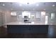 Modern kitchen with an oversized island, granite counters, and lots of storage at 14 Berkten Ct, Hiram, GA 30141