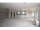 Open-concept living space with white trim, ceiling fan, pendant lights, and tons of sunlight at 14 Berkten Ct, Hiram, GA 30141