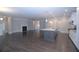 Open concept living room and kitchen with hardwood floors and a fireplace at 14 Berkten Ct, Hiram, GA 30141