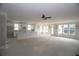 Spacious living room with open concept, white trim, ceiling fan, and an abundance of natural light at 14 Berkten Ct, Hiram, GA 30141