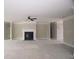 Large living room with fireplace, ceiling fan, and open layout at 14 Berkten Ct, Hiram, GA 30141