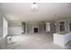 Large open living area with white trim, fireplace, and pendant lights; awaiting finishing touches at 14 Berkten Ct, Hiram, GA 30141