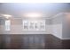 Spacious living room with hardwood floors and large windows at 14 Berkten Ct, Hiram, GA 30141