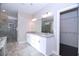Main bathroom features double sinks, a glass shower, and a walk-in closet, combining elegance and convenience at 14 Berkten Ct, Hiram, GA 30141