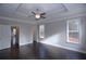 Spacious main bedroom featuring hardwood floors, tray ceilings, with natural light from the adjacent windows at 14 Berkten Ct, Hiram, GA 30141
