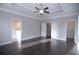 Spacious main bedroom featuring hardwood floors, tray ceilings, with multiple rooms stemming from it at 14 Berkten Ct, Hiram, GA 30141
