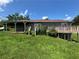 A view of the backyard with an elevated wooden deck and a covered patio space at 3217 Canterbury Trl, Rex, GA 30273