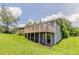 Home's backyard shows a porch and stair access to the basement at 3217 Canterbury Trl, Rex, GA 30273