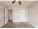 Bedroom featuring neutral paint, carpeting, a ceiling fan and closet at 3217 Canterbury Trl, Rex, GA 30273