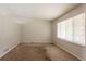 Bedroom featuring neutral paint, carpeting, and natural light from window at 3217 Canterbury Trl, Rex, GA 30273