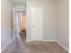 Bedroom with neutral carpet and paint is conveniently located near the bathroom and other bedrooms at 3217 Canterbury Trl, Rex, GA 30273