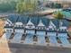 Aerial view of townhomes with driveways at 4220 Cavalier Way, Duluth, GA 30097