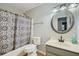 Bathroom featuring a shower/tub combo with curtain, vanity, and classic fixtures at 6118 Dana Ct, Lithonia, GA 30058